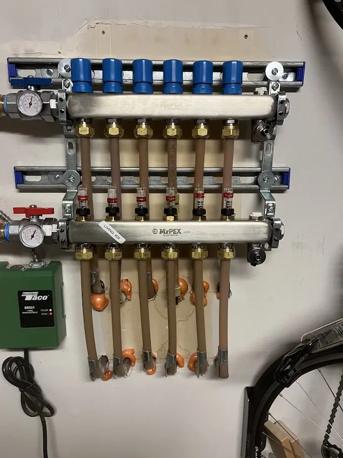 Plumber performing Water Heater Repair at a residential property in Buckley