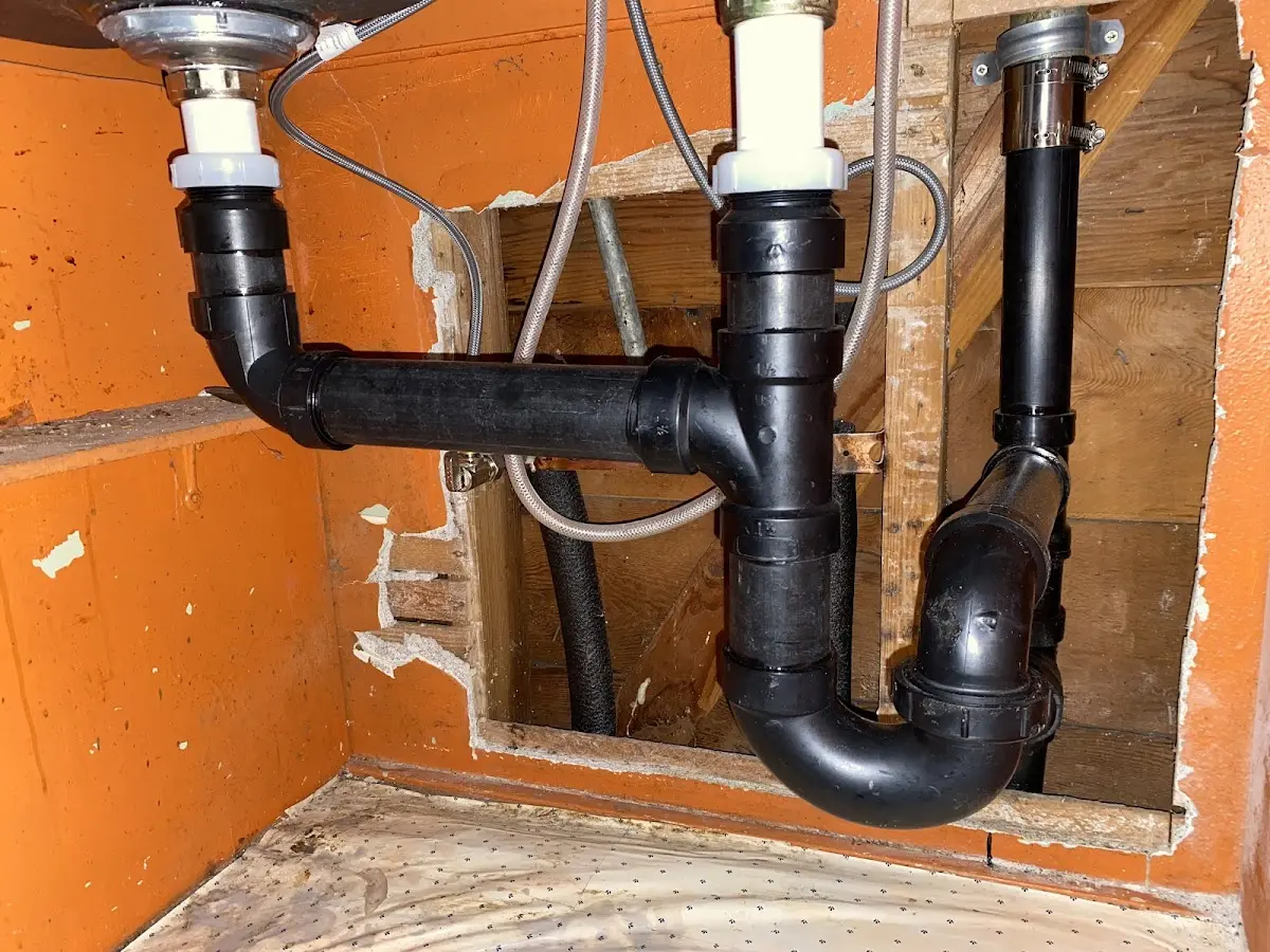 Professional Garbage Disposal Repair equipment and tools on the job in Buckley